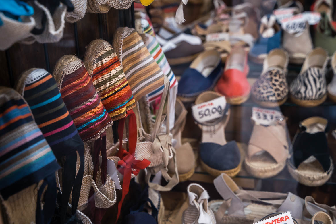 This image shows the storefront of Casa Hernanz with traditional alpargatas.