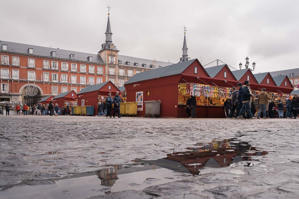 This image shows Plaza Mayor before Christmas. In the middle of the square, there is a Christmas Market.