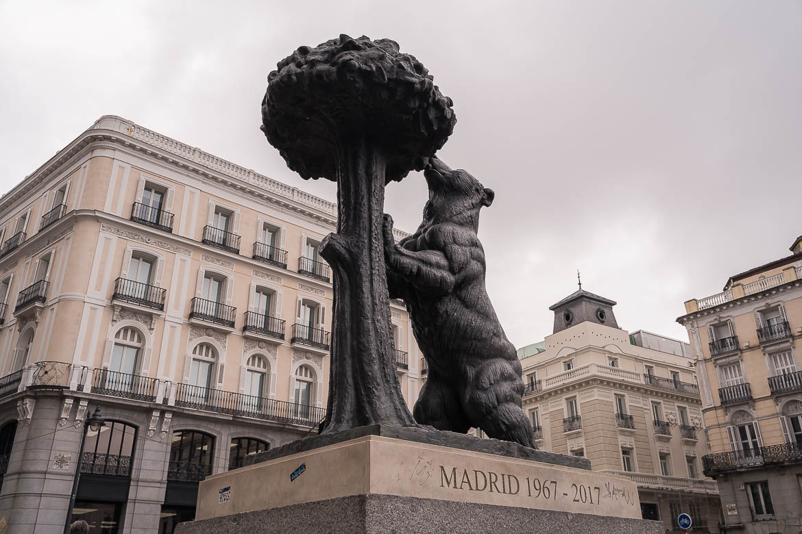 This image shows the statue of the iconic Bear With The Strawberry Tree at Puerta del Sol, one of the most iconic squares to visit in Madrid in 5 days.