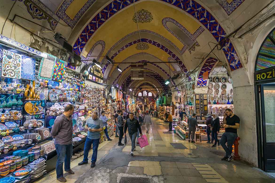 A vaulted corridor in Grand Bazaar. It is lined with shops selling souvenirs.