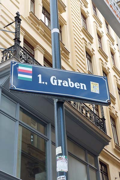 A street sign in Vienna that says "1., Graben".
