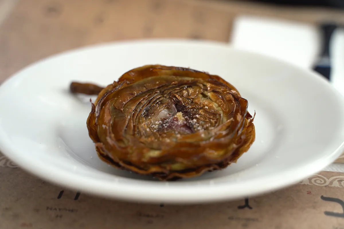 A close-up of Carciofi alla Giudia, a must-try if you're eating vegetarian in Rome.