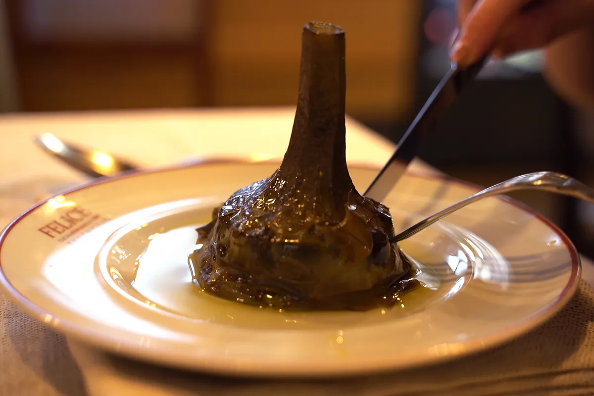 A close-up of Carciofi alla Romana, a must-try on this list of the best vegetarian food in Rome.