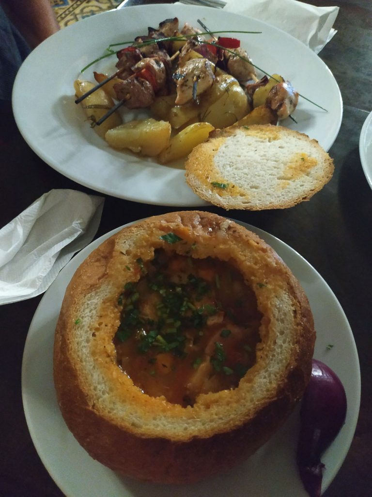 This photo shows some dishes we enjoyed at Caru'cu Bere. Having dinner at this restaurant is among the best things to do in Bucharest, Romania.