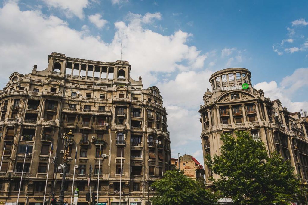 Bucharest walking tour of Communism This photo shows two buildings typical of the Ceausescu era architecture. Bucharest walking tour of Communism, Romania.