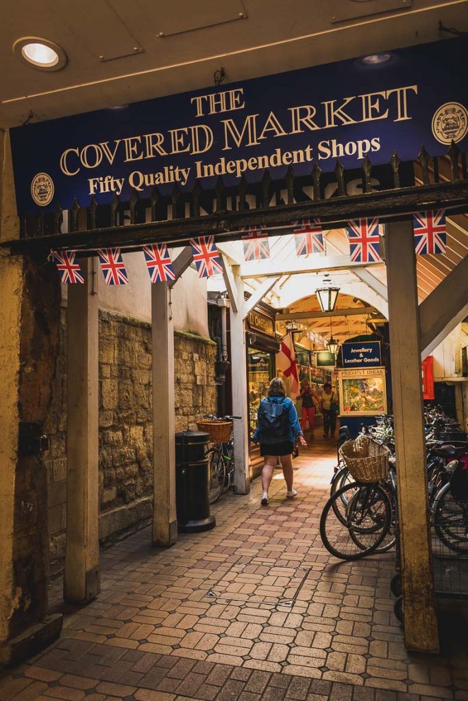 This photo shows the entrance to the Covered Market, Oxford, England, an essential stop for every Oxford day trip.