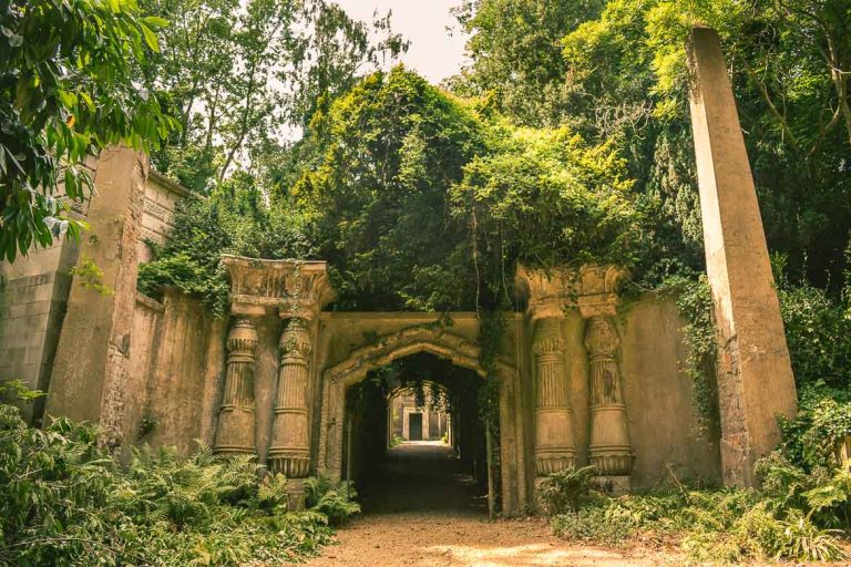 This photo shows the Egyptian Avenue in Highgate Cemetery West in London, England. A visit to Highgate Cemetery is a must for all Victorian London enthusiasts.