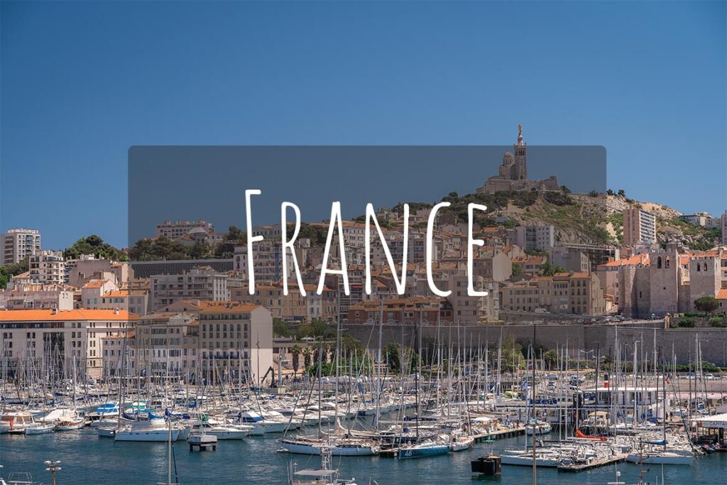 Panoramic view of the Old Port in Marseille. There's overlay text that reads France.