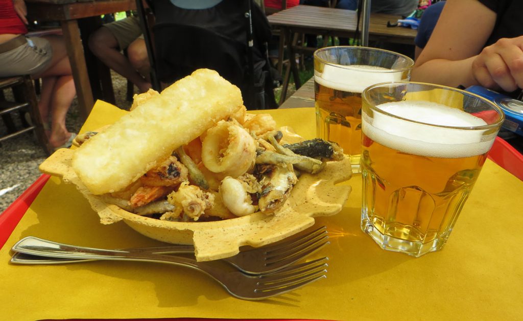 This is a photo of a Fritto misto dish at Taverna Tipica Veneziana in Torcello, Veneto Italy. Venice islands, the perfect Venice day trip.