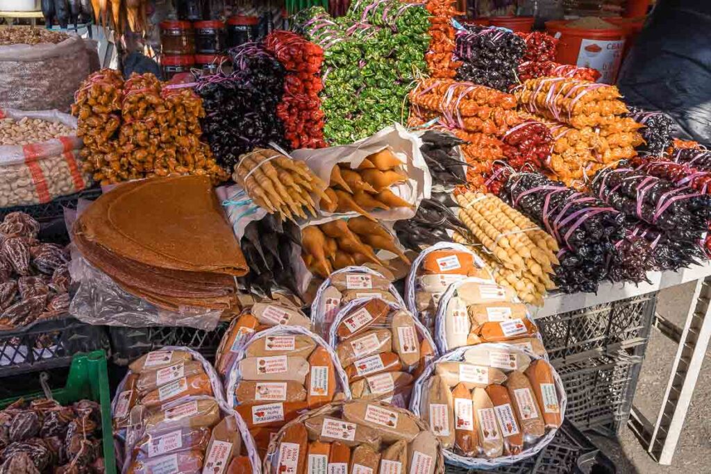A stall with packs of spices and churchkhelas.