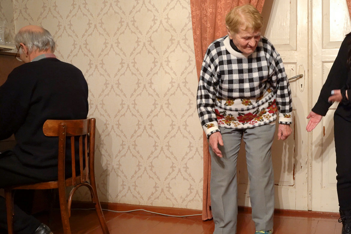 The grandma of the family dancing during the Georgian supra.