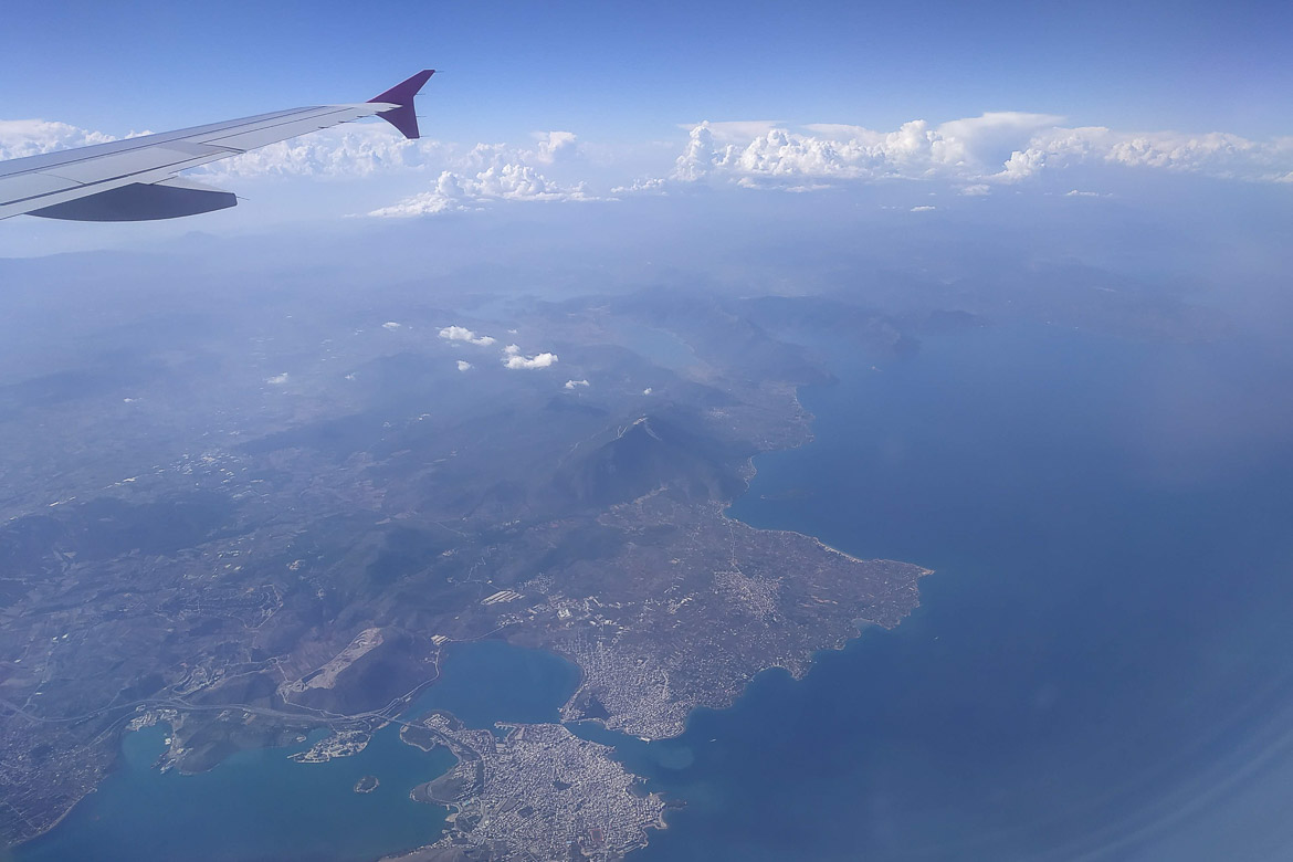 This image shows the view from the aeroplane and it's the featured image for our guide on how to book a flight for beginners. 
