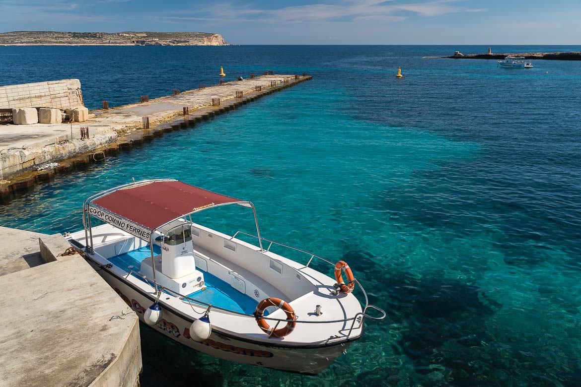 This image shows a boat, which is actually the Comino Ferry, before its departure from Marfa to Comino. If you're wondering how to get to Comino, this ferry is one of the best options. 