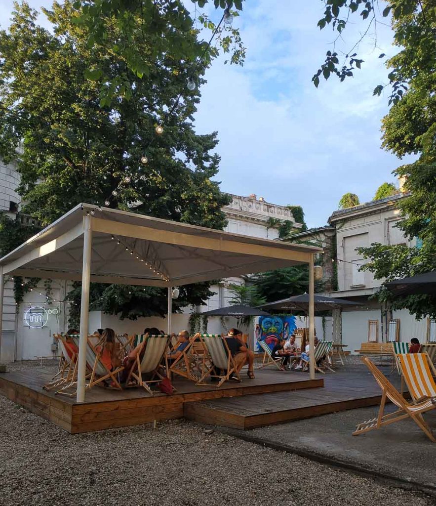 This photo shows the M60 space in Bucharest. Having a beer at its outdoors space is one of the top things to do in Bucharest, Romania.