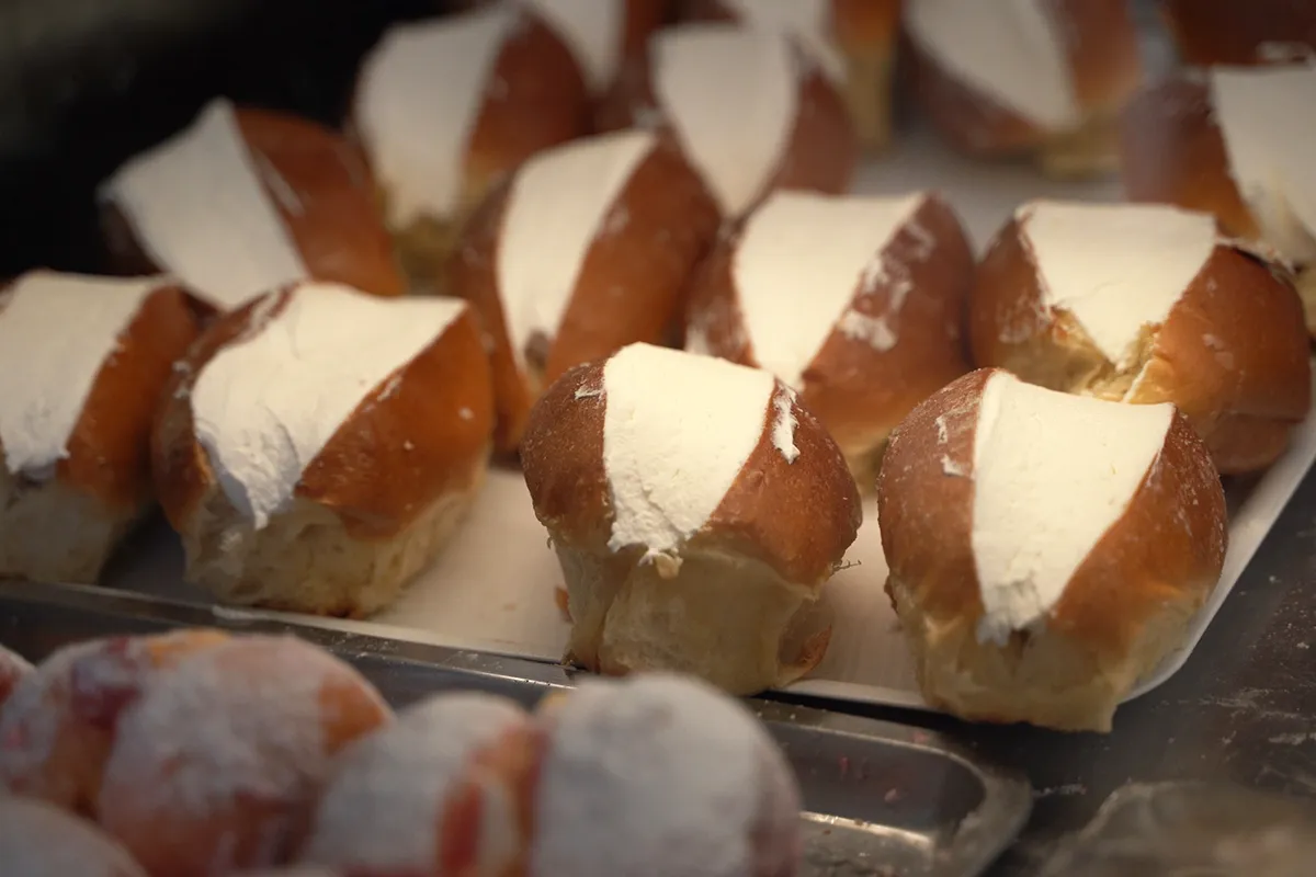 A close-up of several Maritozzo buns.