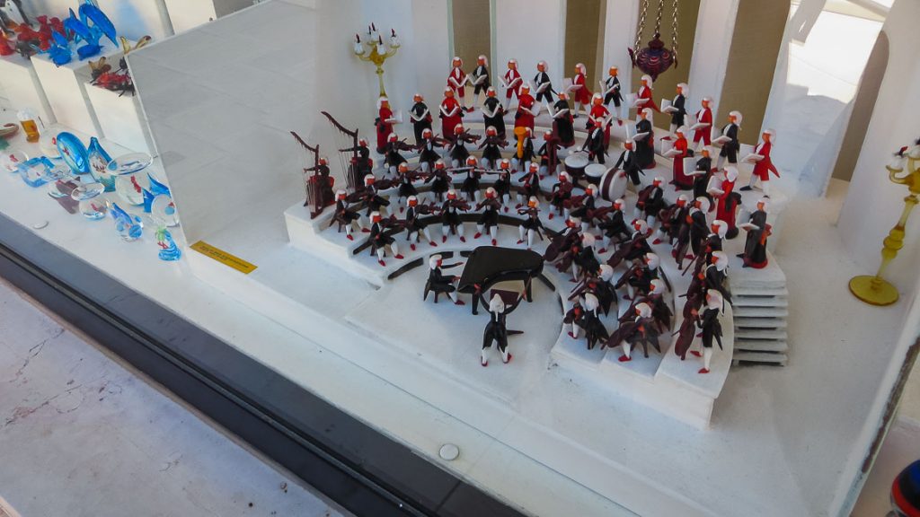 This is a photo of the island of Murano in Veneto, Italy. Window shops are filled with beautiful creations made of Murano glass. Venice Islands the perfect Venice day trip.