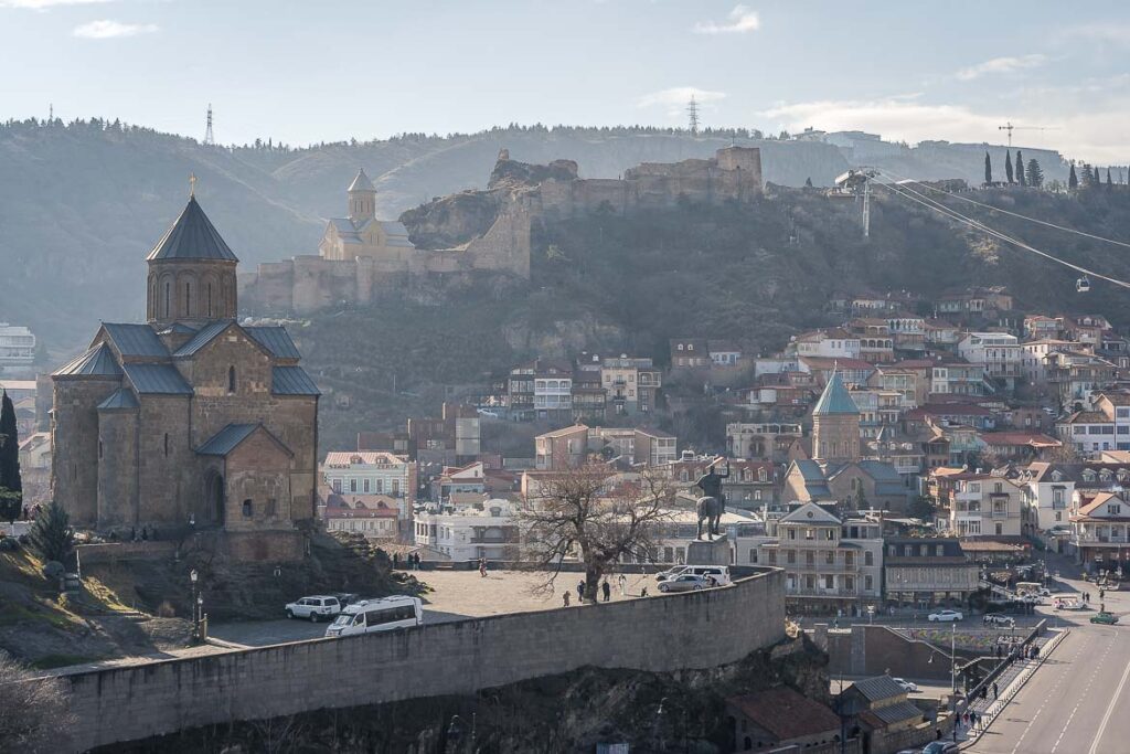 Why You Should Visit Georgia Before Everyone Else Does Panoramic view of Metekhi Church, Narikala Fortress and the Old Town.