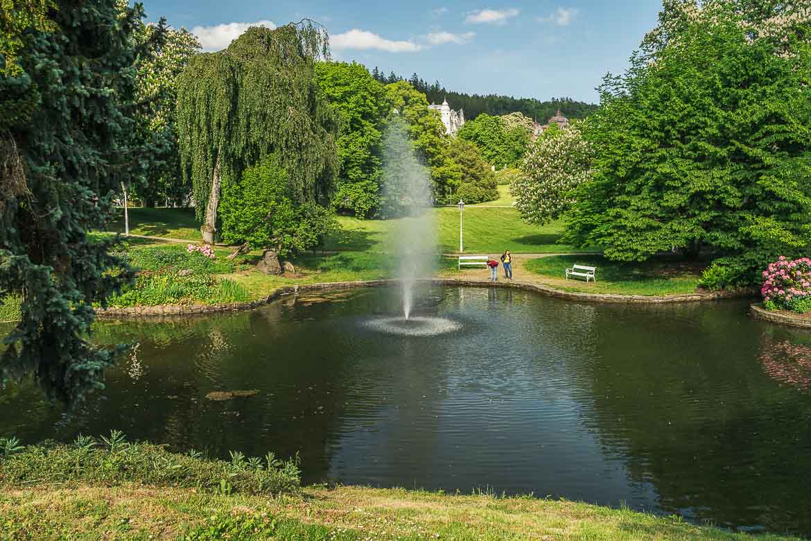 A pond with a fountain at the park in Marianske Lazne.