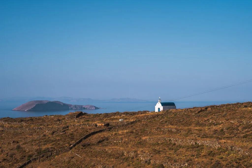 This photo shows a lonely church on a barren slope.