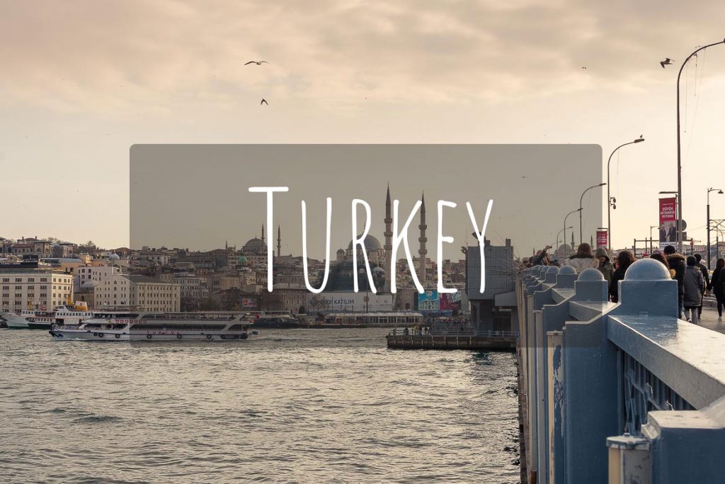 This image shows the Galata bridge in Istanbul with the iconic fishermen standing above the Golden Horn. It's the cover photo of Turkey as a destination.