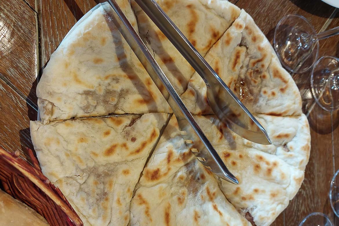 A close up of a Lobiani pie. 