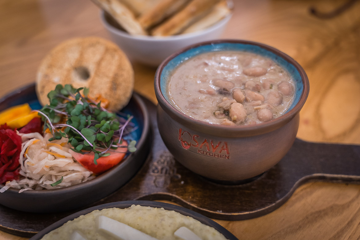 A close up of a bowl filled with bean soup, one of the best vegan dishes in Georgia.  