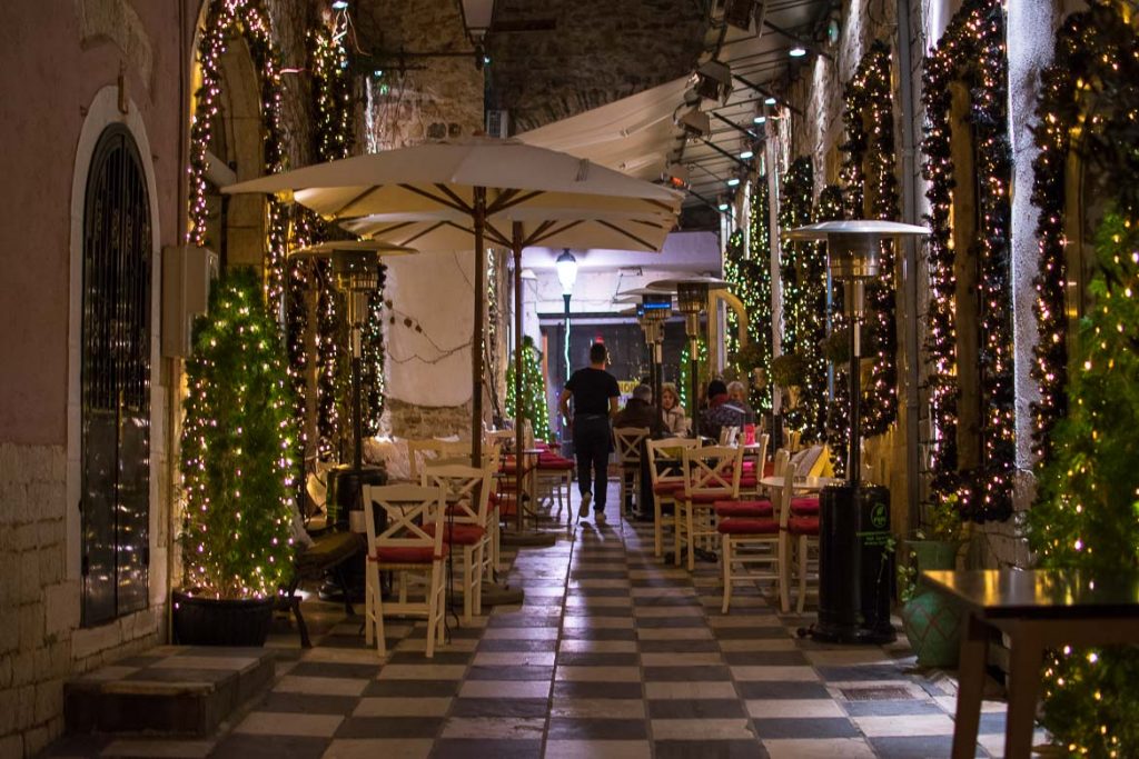 This photo shows one of the arcades in Ioannina Old Town charmingly decorated for the holidays. We've chosen this photo to be the featured image for our article Why visit Ioannina Greece on New Year's Eve.