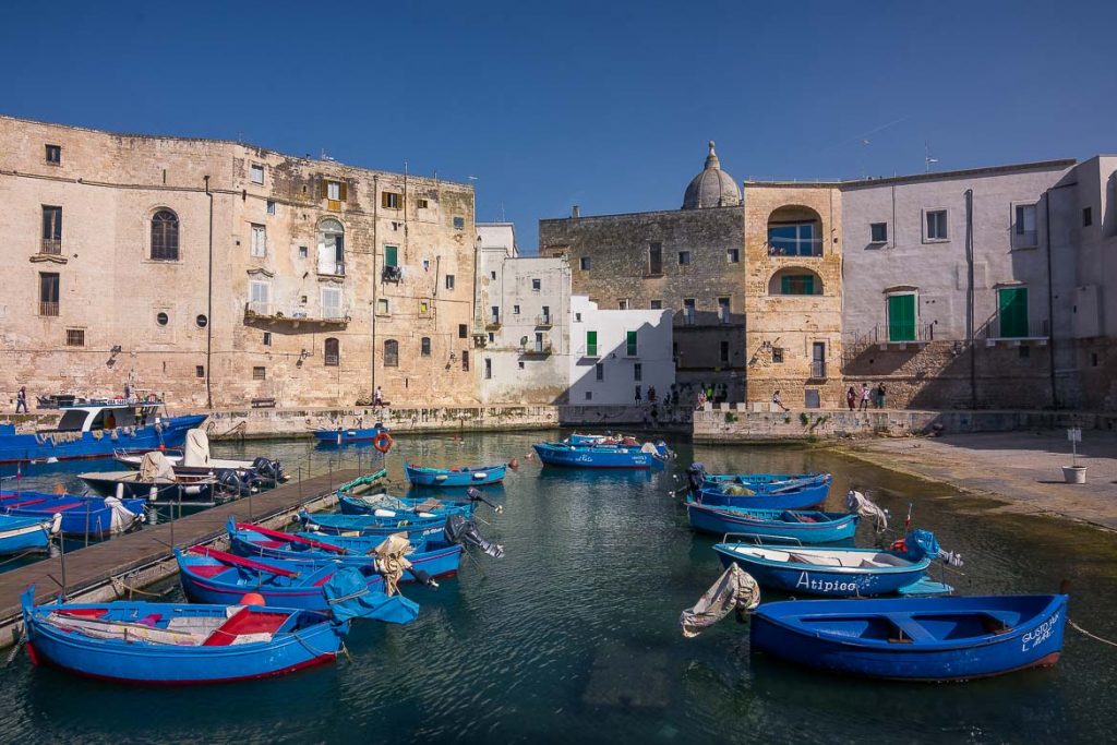 This image shows the old port of Monopoli with the iconic blue fishing boats. If you're wondering what to do in Bari during a longer trip, you should definitely take a day trip to Monopoli.