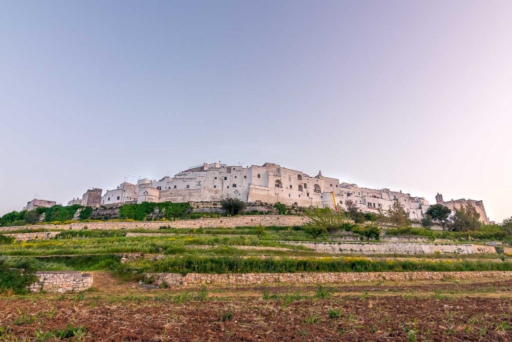 This is a panoramic photo of Ostuni Old Town built atop a hill.