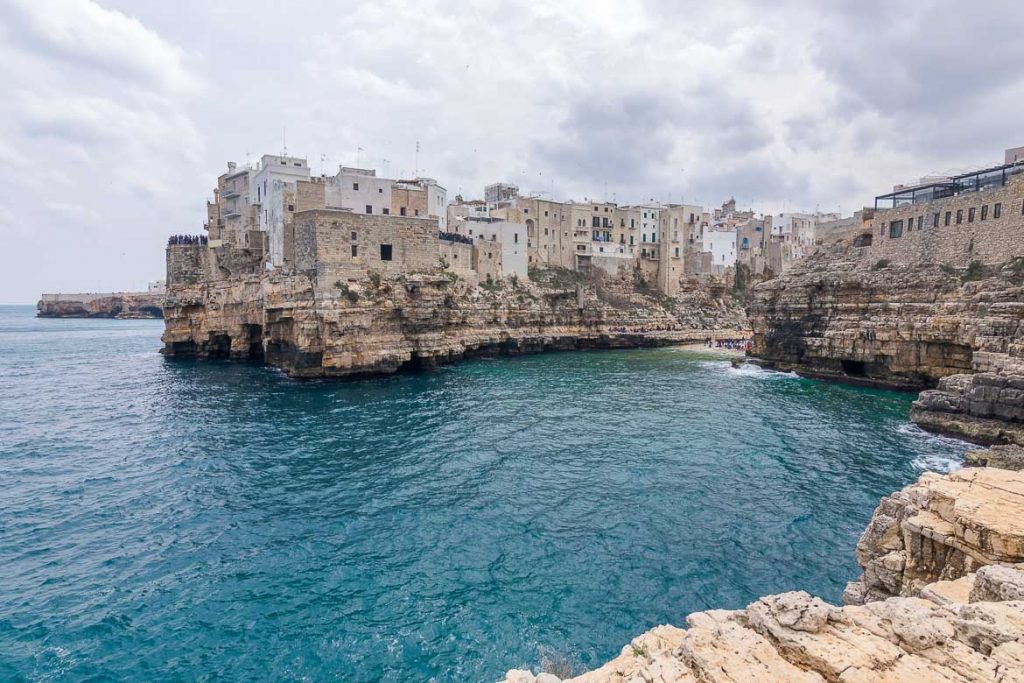 What To Do in Polignano a Mare Italy in One Day This is a panoramic view of Polignano a Mare from Petra Piatta. This is our favourite view of the town. This is why we chose this photo as the featured image of our article: What to do in Polignano a Mare Italy in one day.
