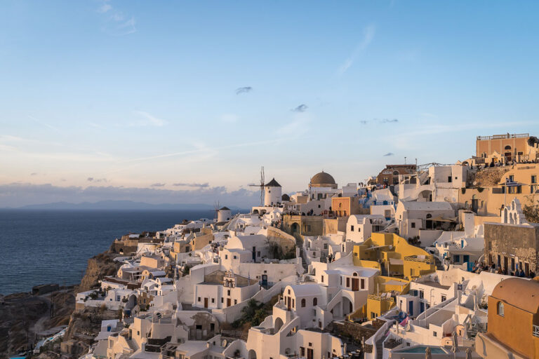 This image shows the unique architecture of Oia with the iconic buildings carved in the volcanic rock. This is one of the most recognisable images of Santorini and this is why we chose it to be the featured image for our article Why Visit Santorini.